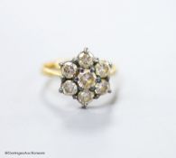 A modern 18ct gold and seven stone diamond cluster ring, size E (sizing spheres), gross weight 3.7