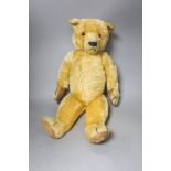 An early 20th century Chad Valley blonde plush teddy bear, length 58cm