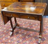 A 19th-century French rosewood sofa table, 86 cm wide with the leaves down, 61.5 cm deep, 75 cm