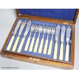 A Victorian cased set of eighteen pairs of ivory handled engraved silver fish eaters by John