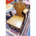 A pair of William IV oak hall chairs, stamped Gillows, Lancaster