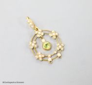 An early 20th century 9ct, peridot and seed pearl set drop pendant, overall 35mm, gross weight 2.1