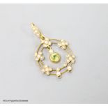 An early 20th century 9ct, peridot and seed pearl set drop pendant, overall 35mm, gross weight 2.1