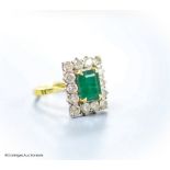 A modern 18ct gold, emerald and diamond set rectangular cluster ring, size K,gross weight 6 grams.