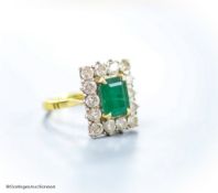 A modern 18ct gold, emerald and diamond set rectangular cluster ring, size K,gross weight 6 grams.