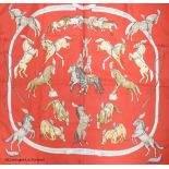 Three vintage Hermes silk scarves, 'Grand Apparat' (red, black and gold), 'En Piste' (red ground)