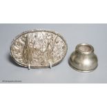 A small silver inkwell and a small plated figural plaque