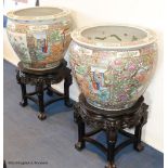 A pair of Chinese famille rose gold fish bowls, 56cm diameter with ebonised and marble inset
