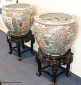 A pair of Chinese famille rose gold fish bowls, 56cm diameter with ebonised and marble inset