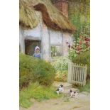 Arthur Claude Strachan, (Scottish, 1865-1938), watercolour, 'At Evesham', puppies beside a cottage,