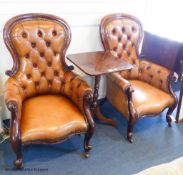 A pair of Victorian walnut and tan leather spoonback armchairsProvenance - a country estate near