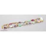 An early 20th century yellow metal and multi gem set bracelet, including white opal, turquoise,