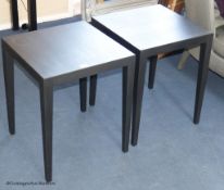 A pair of ebonised lamp tables, 45 cm wide, 55 cm highProvenance - a country estate near Rye,