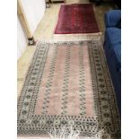 A Bokhara style rug, 166 x 97cm and another pale pink ground rug