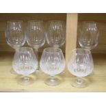 Four John Rocha Waterford wine glasses and three Stuart cut glass brandy glasses