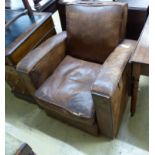 A 1930's French distressed leather club armchair, width 81cm