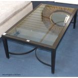 An ebonised ash and glass coffee table, 120 cm long, 70 cm deep, 40 cm highProvenance - a country