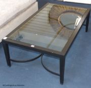 An ebonised ash and glass coffee table, 120 cm long, 70 cm deep, 40 cm highProvenance - a country