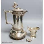 A Victorian Elkington & Co silver plated hot water jug, 27.7cm, an Edwardian silver cream jug and