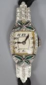 A lady's 1940's/1950's white metal (stamped platinum), emerald? and diamond set cocktail watch, on