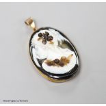 A late Victorian gilt metal mounted oval banded agate pendant, carved with the bust of a lady to