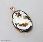 A late Victorian gilt metal mounted oval banded agate pendant, carved with the bust of a lady to