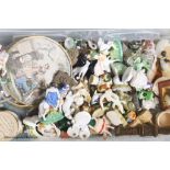 A collection of miniature ceramic and glass figures and animals, treen, enamel patch boxes,