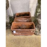 A set of three terracotta garden troughs and four similar troughs, approx. 40cm, wide