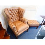 A pair of George III style buttoned tan leather wingback armchairs and two matching