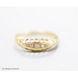 An Edwardian 18ct gold and five stone diamond chip set half hoop ring, size R, gross 2.6 grams,