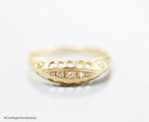 An Edwardian 18ct gold and five stone diamond chip set half hoop ring, size R, gross 2.6 grams,