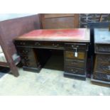 An Edwardian walnut pedestal desk, length 136cm