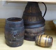 A coopered jug, height 44cm, a barrel and a dog cask