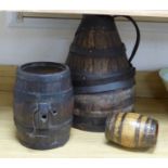 A coopered jug, height 44cm, a barrel and a dog cask