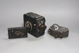 A Bell & Howell Filmo 8mm camera, an Agfa cine camera and another