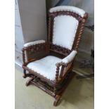 A late 19th century American walnut rocking chair