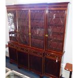 A 19th century and later satinwood banded mahogany breakfront bookcase, 241.5 cm high,