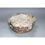 An unusual Japanese Sumida style pottery bowl, figures with detaching heads, diameter 32cm