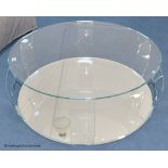 A contemporary glass circular coffee table, with mirrored base, 98 cm wide, 33 cm highProvenance -