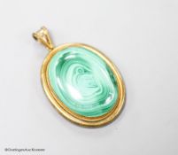 A Victorian yellow metal and malachite set oval pendant, with glazed back, overall 56mm,gross