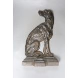 A Victorian Coalbrookdale style cast iron seated spaniel doorstop, registration mark, length 37cm