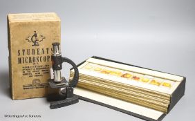 A case of early 20th century microscopes slides and a student's microscope