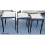 A pair of ebonised ash and parchment topped lamp tables, each 40 cm wide, 60 cm high, and a similar