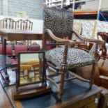 A late 19th century leopard print upholstered wooden elbow chair and a mahogany toilet mirror