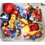 A collection of Noddy and Mickey Mouse toys