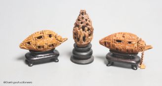 Three Chinese peach stone carvings on stands