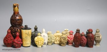 A large Chinese 20th century carved snuff bottle and smaller snuff bottles