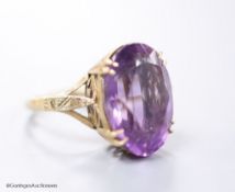 A 9ct gold and oval cut amethyst set dress ring, size H,gross 5.6 grams.