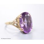 A 9ct gold and oval cut amethyst set dress ring, size H,gross 5.6 grams.