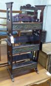 An Arts and Crafts brass inset mahogany book rack, width 43cm, height 90cm